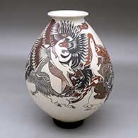 A polychrome jar with a rolled lip and decorated with a wildlife and geometric design
 by Manuel Rodriguez of Mata Ortiz and Casas Grandes