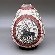 A polychrome jar decorated with a sgraffito and slipped four panel wildlife, bird, branch, leaf and geometric design
 by Unknown of Mata Ortiz and Casas Grandes