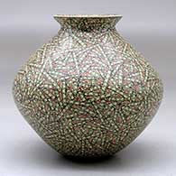 A small polychrome jar with a flared lip and decorated with a tiny lines and rectangles geometric design, click or tap to see a larger version