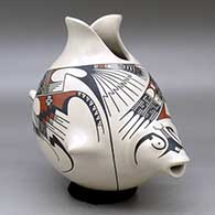 A polychrome fish effigy pot decorated with a two panel open and flowing geometric design
 by Lydia Quezada of Mata Ortiz and Casas Grandes