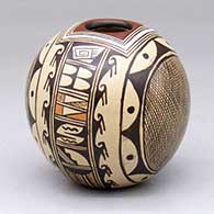 A polychrome seed pot decorated with a four-panel hachure, bird element and geometric design
 by Cynthia Sequi of Hopi