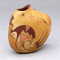 A gourd-shaped pot decorated a bird element and geometric design, plus a couple lady bug appliques
 by Gabriel Tahbo of Hopi