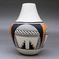 A polychrome jar decorated with a four-panel geometric design around the body, click or tap to see a larger version