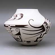 A polychrome jar decorated with a two-panel bird element and geometric design, click or tap to see a larger version
