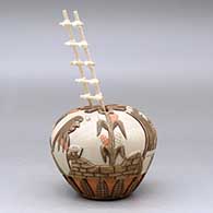 A polychrome seed pot carved and painted with a kachina, corn plant and pueblo geometric design, plus a kiva ladder, click or tap to see a larger version