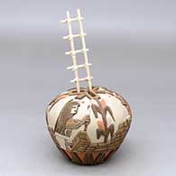A polychrome seed pot carved and painted with a kachina, corn plant and pueblo geometric design, plus a kiva ladder
 by Lawrence Namoki of Hopi