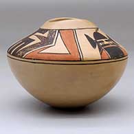 A polychrome jar with an organic opening and decorated with a kachina and geometric design above the shoulder, click or tap to see a larger version