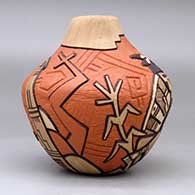 A polychrome jar with an organic opening and lightly carved and painted with a kachina dancer, bird element, corn plant and geometric design, click or tap to see a larger version