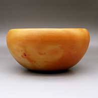A large Jeddito black on yellow bowl decorated inside with a four-panel geometric design, and outside with fire clouds, click or tap to see a larger version