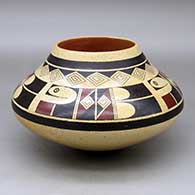 A polychrome bowl decorated with a four panel bird element and geometric design above the shoulder
 by Stetson Setalla of Hopi
