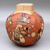 A polychrome jar decorated with a carved, sgraffito and painted line of kachina dancers and geometric design
 by Elvira Nampeyo of Hopi