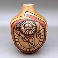 A polychrome jar decorated with a two panel carved, sgraffito and painted kachina dancer, bird element and geometric design
 by Elvira Nampeyo of Hopi
