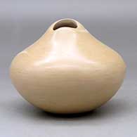 A polished buff jar with an organic opening and an ear of corn applique, click or tap to see a larger version