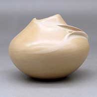 A polished buff jar with an organic opening and an ear of corn applique, click or tap to see a larger version