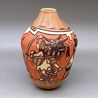 A polychrome jar decorated with a carved, sgraffito and painted Nataska and Mudhead clan dancers and geometric design
 by Elvira Nampeyo of Hopi