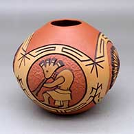 A polychrome jar decorated with a four panel kokopelli, sun katsina and geometric design
 by Elson Seckletstewa of Hopi