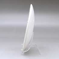 A polychrome plate decorated with a geometric design, click or tap to see a larger version