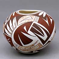 A polychrome jar with an organic opening and decorated with a geometric design
 by Maynard Navasie of Hopi