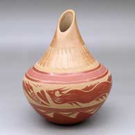 A polychrome jar with an organic opening and decorated with a sgraffito-and-slipped avanyu, feather and geometric design
 by Vangie Tafoya of Jemez