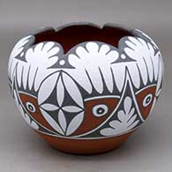 A bowl with a scalloped rim and decorated with a four-panel bird element and geometric design
 by Mary Small of Jemez