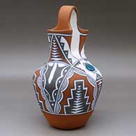 A polychrome wedding vase with two pieces of inlaid turquoise and decorated with a four-panel geometric design, click or tap to see a larger version