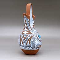 A polychrome wedding vase with two pieces of inlaid turquoise and decorated with a geometric design, click or tap to see a larger version