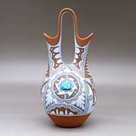 A polychrome wedding vase with two pieces of inlaid turquoise and decorated with a geometric design, click or tap to see a larger version