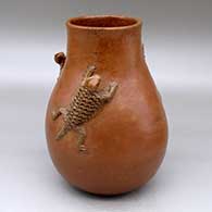 A brown jar decorated with three horned toad appliques above the shoulder
 by Faye Tso of Dineh
