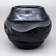 Small black jar with a carved avanyu design
 by Elizabeth Naranjo of Santa Clara