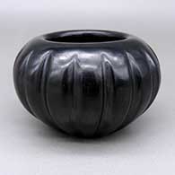 Black melon jar with sixteen carved and polished ribs
 by Angela Baca of Santa Clara