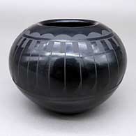 Black-on-black jar with a feather ring and geometric design
 by Annie Baca of Santa Clara