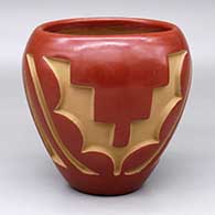 A red jar carved with a four-panel geometric design
 by Belen Tapia of Santa Clara