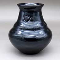 A double-shouldered black jar with four bear paw imprints and a flared rim
 by Nathan Youngblood of Santa Clara