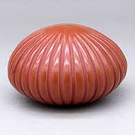 A carved red melon jar with 32 ribs
 by David Baca of Santa Clara