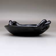 A polished black serving plate with twisted handles, click or tap to see a larger version