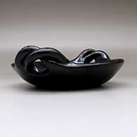 A polished black serving plate with twisted handles, click or tap to see a larger version