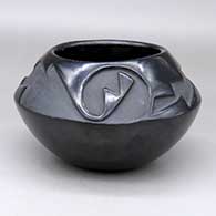 A black bowl carved above the shoulder with a two-panel geometric design
 by Pablita Chavarria of Santa Clara