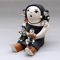 A sitting grandmother storyteller figure with five children
 by Mary Frances Herrera of Cochiti