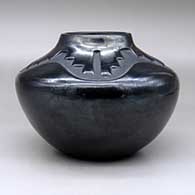 A black, high-shouldered jar decorated with a four-panel kiva step and geometric design above the shoulder, click or tap to see a larger version
