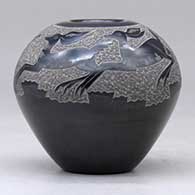A black seed pot decorated with a sgraffito deer and geometric design above the shoulder, click or tap to see a larger version