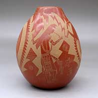 A red jar decorated with a sgraffito design incorporating several Mimbres figures, warriors and geometric designs, click or tap to see a larger version