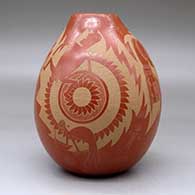 A red jar decorated with a sgraffito design incorporating several Mimbres figures, warriors and geometric designs, click or tap to see a larger version