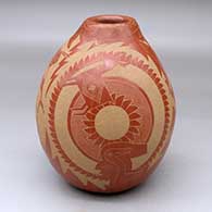 A red jar decorated with a sgraffito design incorporating several Mimbres figures, warriors and geometric designs
 by Roy Tanner of Santa Clara