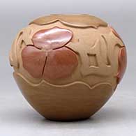 A red and buff jar carved and polished with a four panel geometric design around the shoulder, click or tap to see a larger version