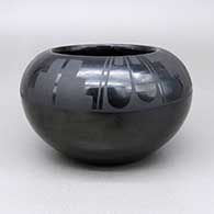 Black-on-black jar with a feather, kiva step, and geometric design
 by Marvin and Frances Martinez of San Ildefonso