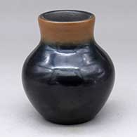 A plain black jar with a recurved sepia neck
 by Dora Tse Pe of San Ildefonso