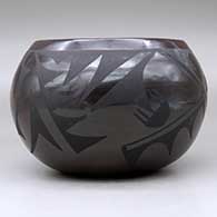 A black on black jar decorated with a geometric design around the body, click or tap to see a larger version