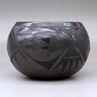 A black on black jar decorated with a geometric design around the body, click or tap to see a larger version