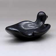 A black bird bowl with a geometric design on the inside, click or tap to see a larger version