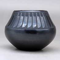 A black on black jar decorated with a ring of feathers design above the shoulder, click or tap to see a larger version